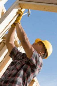 Construction worker checking building